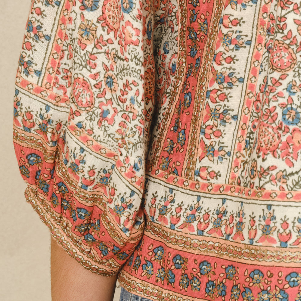 
                  
                    Floral and border detail printed cotton jacket with gathered 3/4 sleeves
Woven striped cotton lining
Side slip pockets
Cotton lace trim detail

Fits true to size. Relaxed, comfortable fit with wide arm opening. Model is 5'9" and wearing a size S.

Hand wash only.
                  
                