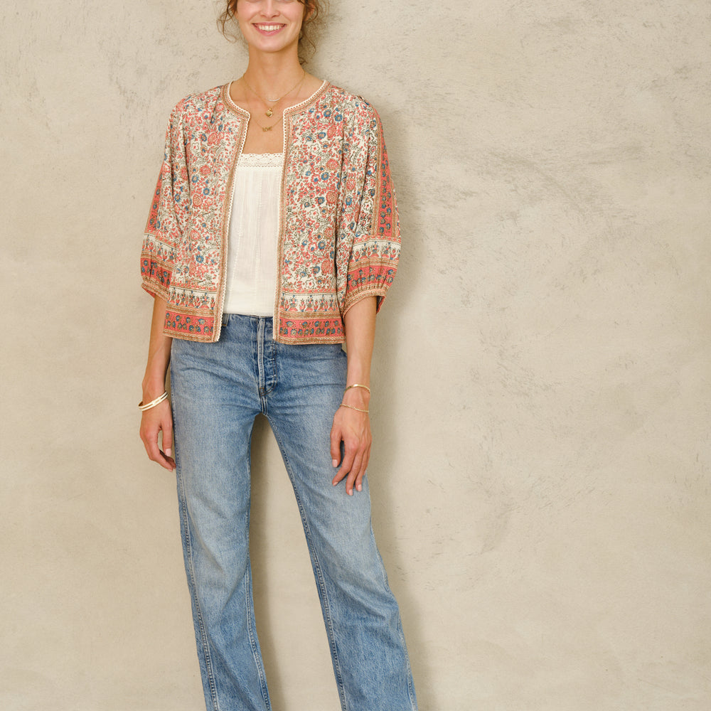 
                  
                    Floral and border detail printed cotton jacket with gathered 3/4 sleeves
Woven striped cotton lining
Side slip pockets
Cotton lace trim detail

Fits true to size. Relaxed, comfortable fit with wide arm opening. Model is 5'9" and wearing a size S.

Hand wash only.
                  
                