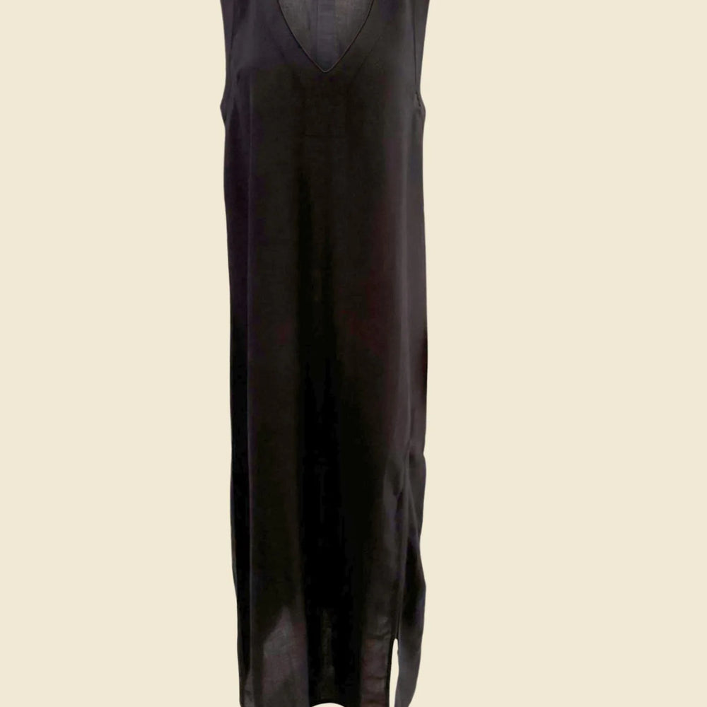 
                  
                    One of our most versatile pieces! Cut from a cotton, viscose, blend, the Grotta Midi Dress is A-line dress with a relaxed silhouette, a deep v-neckline, and one high slit in the front for an elevated feminine look. Paired with your favorite swimsuit, the Grotta Midi Dress is perfect for the pool, beach, and beyond. 


                  
                